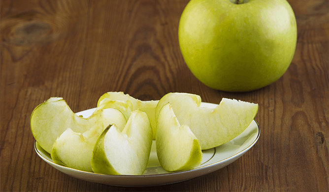 Apply a bit of salt to prevent the cut apples from blackening.